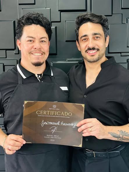 Jose Manuel receiving a professional education certificate from color educator Rafael Braz
