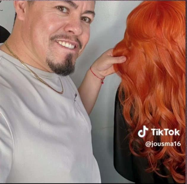 Vivid copper-red hair color styled by Jose Manuel